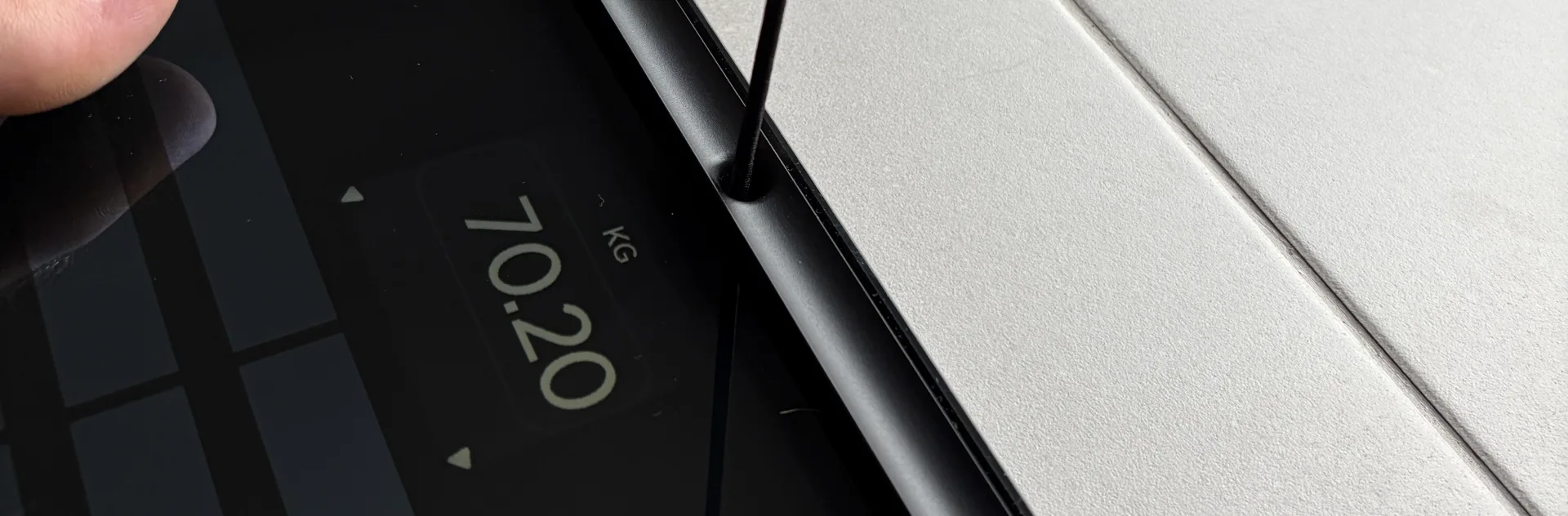 Affichage du poids sur l'écran (70,20 kg)